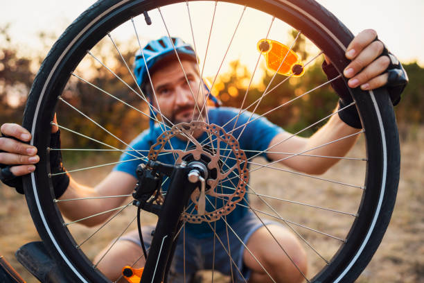 repairing his bike - mountain cycling bicycle tire imagens e fotografias de stock