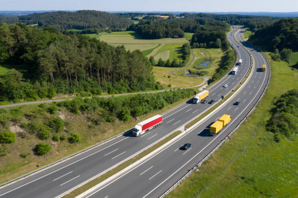 multiple lane highway with trucks, aerial view - multiple lane highway highway car field imagens e fotografias de stock