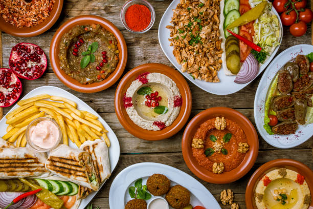 istock assorted Turkish dishes, hummus, muhamara, mutabal, falafel, shawarma 1185944446