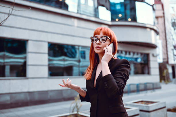 istock Elegant Business Female Talking On Phone 1185950310