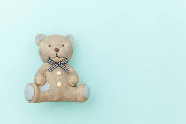 istock Toy bear isolated on pastel blue background 1185951846