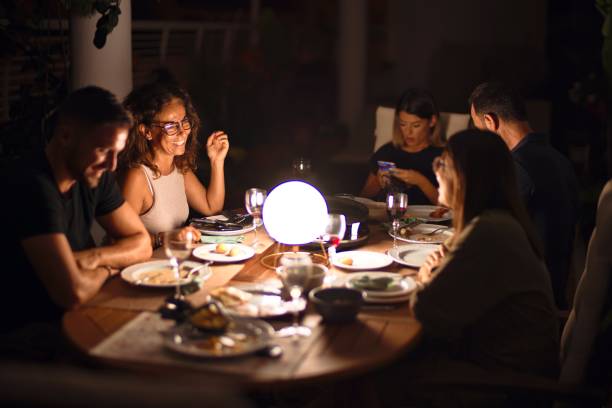 istock Beautiful family on dinner talking and smiling at terrace 1185955238