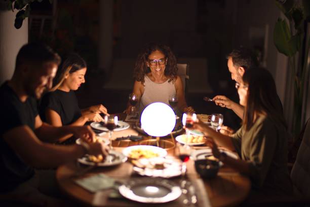 istock Beautiful family on dinner talking and smiling at terrace 1185955280