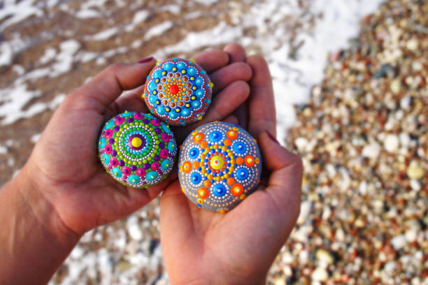istock Beautiful hand painted mandala rocks 1185955501