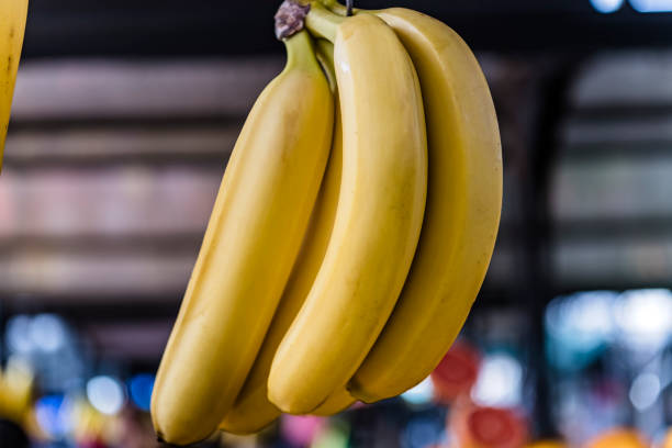 Fresh ripe banana fruit on kitchen tabletop .