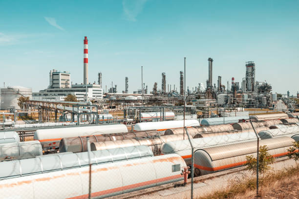 Fuel and chemical plant and industrial area with storage and railway tanks for transportation of liquids Fuel and chemical plant and industrial area with storage and railway tanks for transportation of liquids lng liquid natural gas stock pictures, royalty-free photos & images