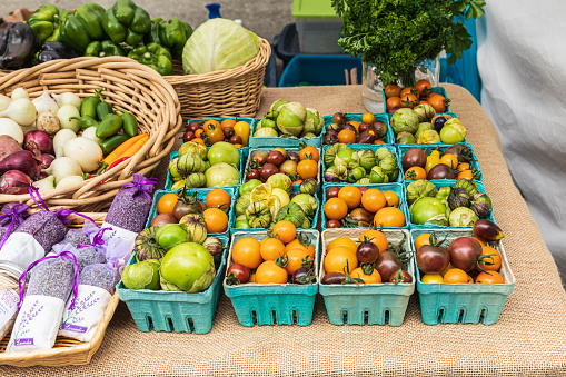 USA, Washington State, Vancouver. Fresh heirloom tomatoes for sale at a farmers market.