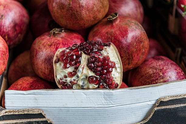 Close-up View at the Fresh and Delicious Pomegranates at the Farmers Market.