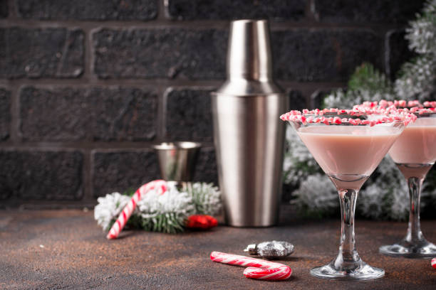 istock Pink peppermint martini with candy cane rim 1185962381