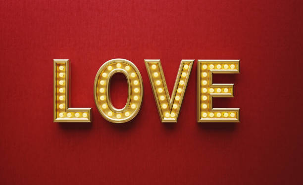 istock Letters Made of Light Bulbs Forming Love Text on Red Background 1185963284