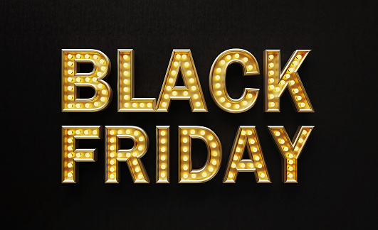 Letters made of gold and light bulbs forming Black Friday text on black background. Horizontal composition with copy space. Black Friday concept.