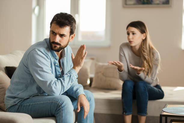 istock Young angry man having relationship difficulties with his girlfriend 1185964420