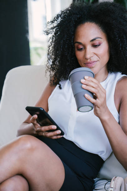 istock Cheerful woman using smartphone 1185964531