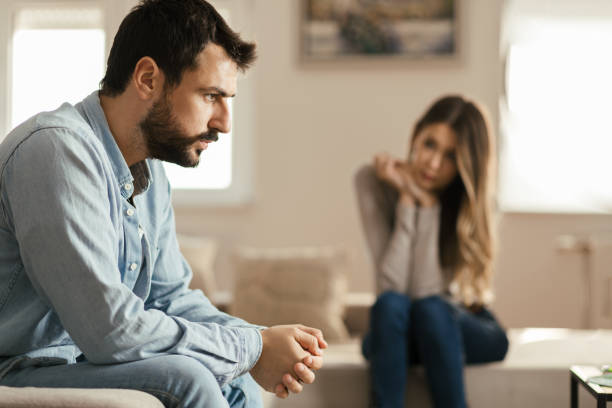 istock Young couple having problems in their relationship at home 1185964585
