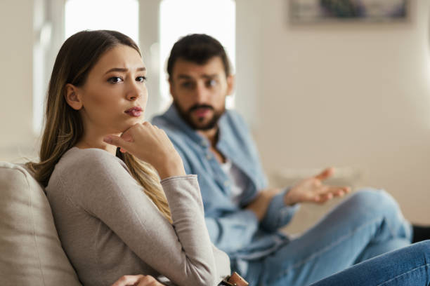 istock Young sad woman having relationship difficulties with her boyfriend 1185964628