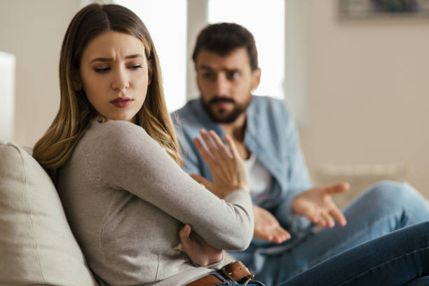 istock Young sad woman having relationship difficulties with her boyfriend 1185965156