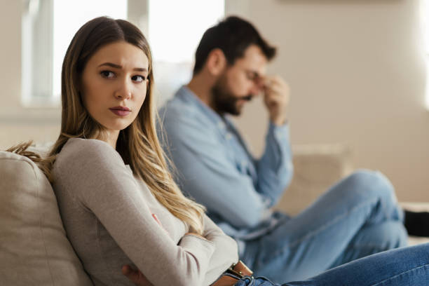istock Young sad woman having relationship difficulties with her boyfriend 1185965212