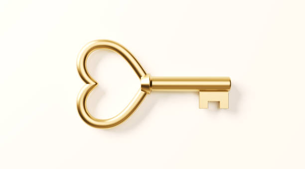 Businessman hand holding key icon on dark background.