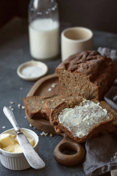 istock Fresh homemade brown bread on gray concrete background. 1185965460