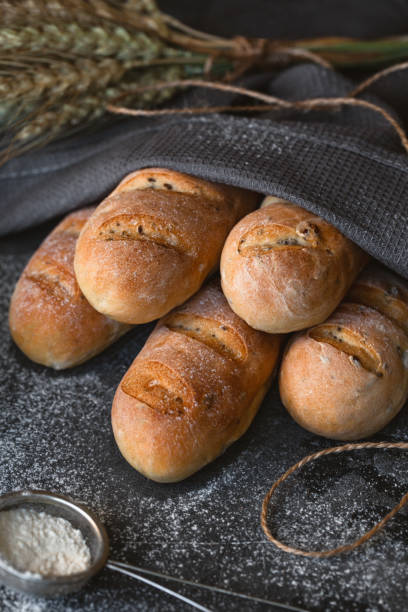istock French baguette bread on vintage kitchen table. View from the top 1185965486
