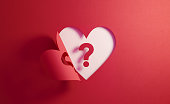 Uncertainty Concept- Question Mark Inside Of A Red Folding Heart Shape On White Background