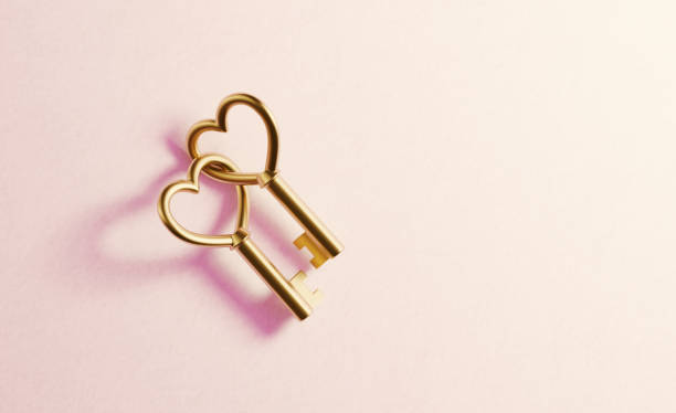 Gold Heart Shaped Key Pair on Red Background