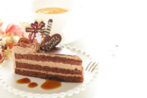A china tea cup and saucer with a tea plate and chocolate cake.
