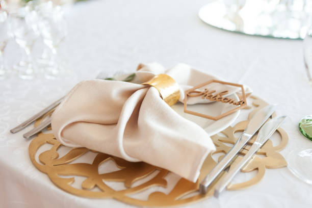 istock Wedding table setting, tableware for the newlyweds, on a plate a napkin and a rustic sign word - bride or groom 1185975048