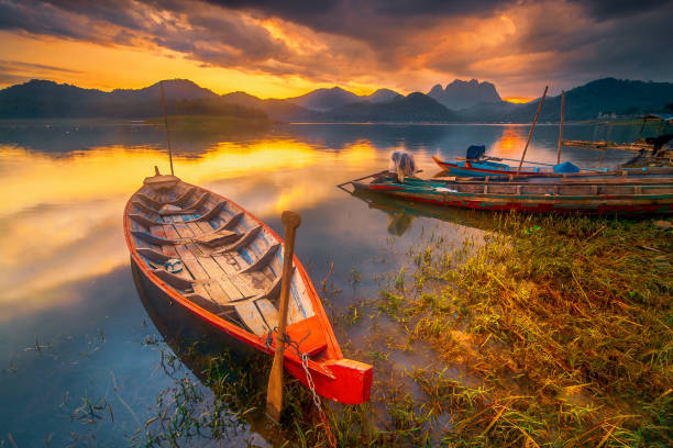 Dramatic sunset with the boat in the Jatiluhur reservoir