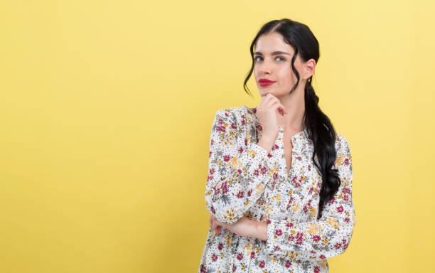 istock Young woman in a thoughtful pose 1185978742