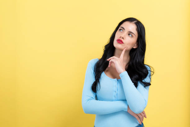 istock Young woman in a thoughtful pose 1185978746