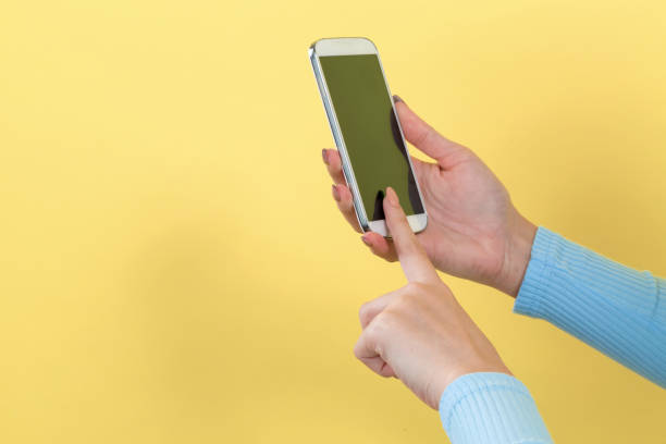 istock Woman using her smartphone 1185978766