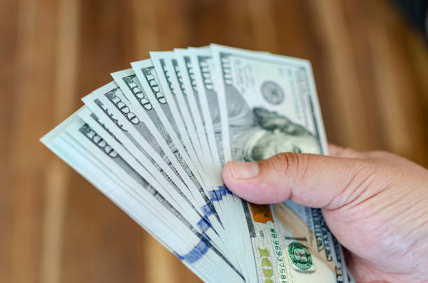 istock Some 100 dollar bills. cash. bucks. flow. money 1185979799