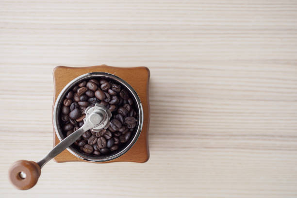 istock Vintage manual coffee grinder with roasted coffee beans 1185979854