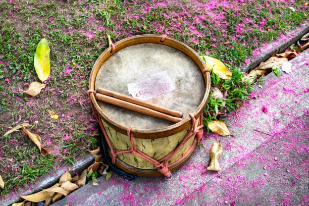 Mobile snare drum played in a marching band, musical percussion instrument for the rhythm at a parade on the street, selected focus, narrow depth of field