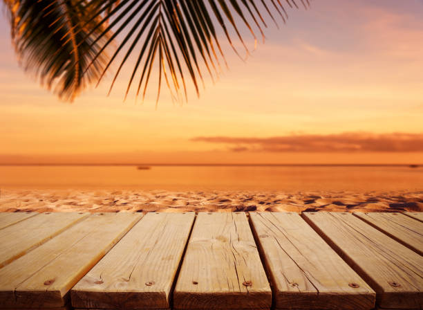 istock Wood plank on the sunset beach 1185985685