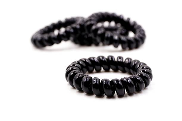 istock Black plastic elastic hair bands 1185987157