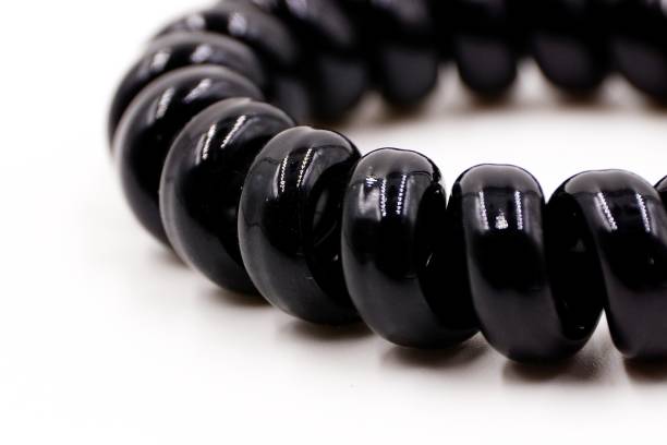 istock Black plastic elastic hair bands 1185989329