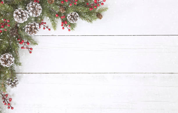 istock Christmas pine garland border on an old white wood background 1185997971