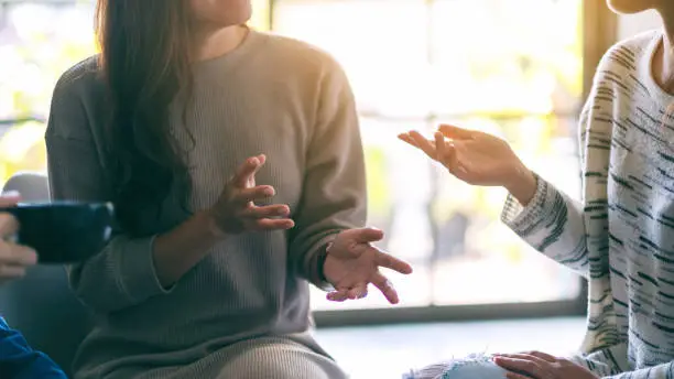 Photo of women enjoyed talking and drinking coffee together