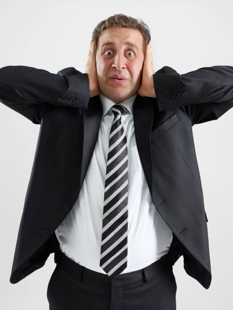 Hear no evil Businessman covering his ears speak no evil stock pictures, royalty-free photos & images