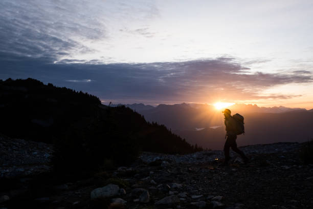 istock Solo male hiking at sunrise 1186010073