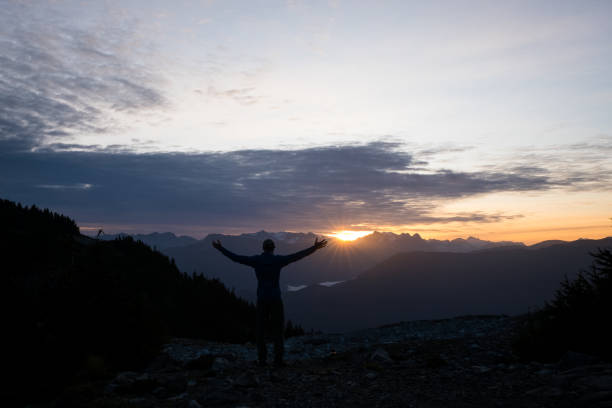 istock Male hiker watches the sunrise 1186010134