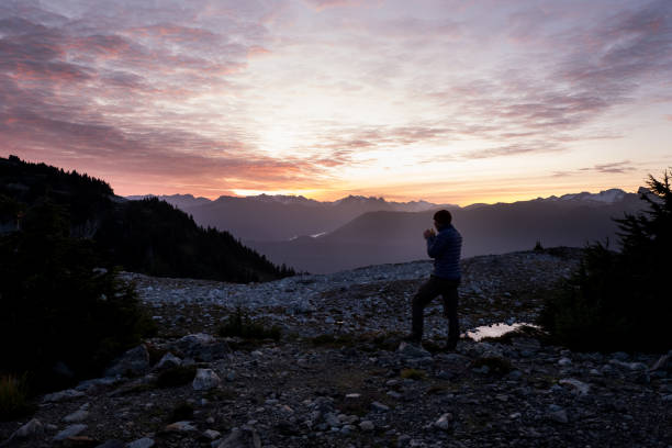 istock Male hiker watches the sunrise 1186010189