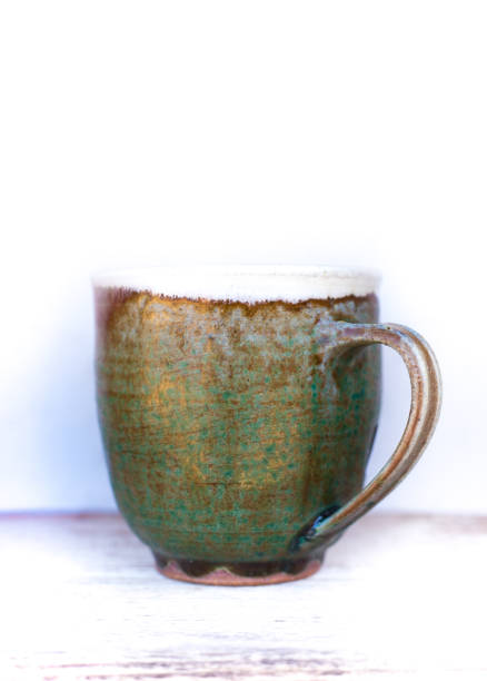 istock Handmade Coffee Mug on White Shelf, Close-Up with Copy Space 1186013596
