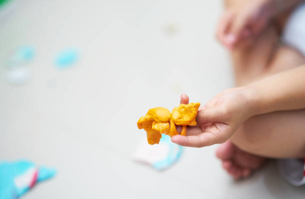 istock Kid hand holds slime in hand while playing in home activity toy learning concept 1186022730