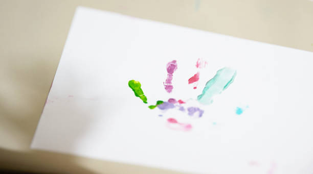 istock Fingers and hand printed on art paper 1186022835