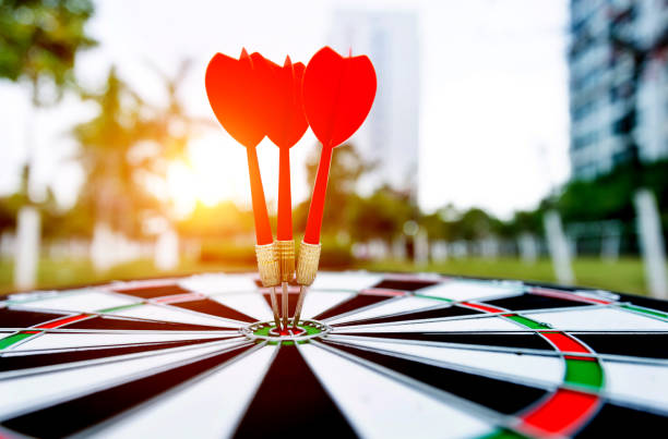 istock Three darts on dart board outdoors 1186023837
