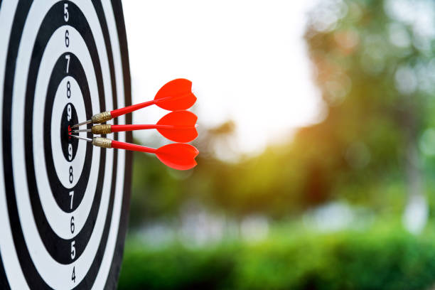 istock Three darts on dart board outdoors 1186024489