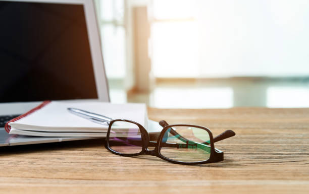 istock Laptop with pen and notepad on the desk 1186024723